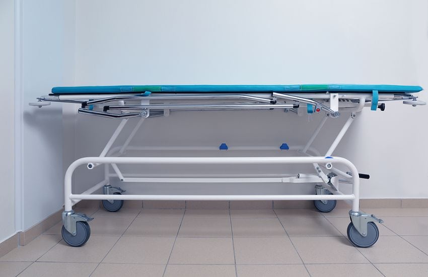 Medical Stretcher Sitting Up Against A Wall