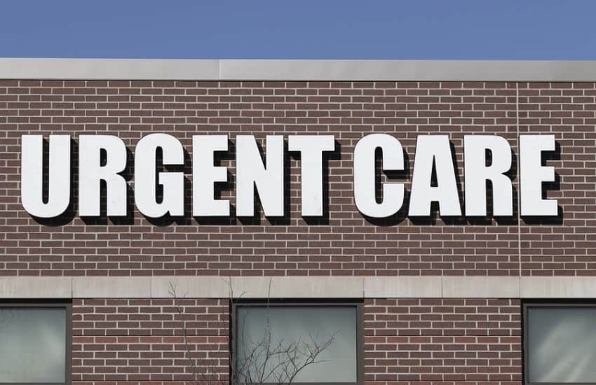 The Front Of A Building With A Large Urgent Care Sign.